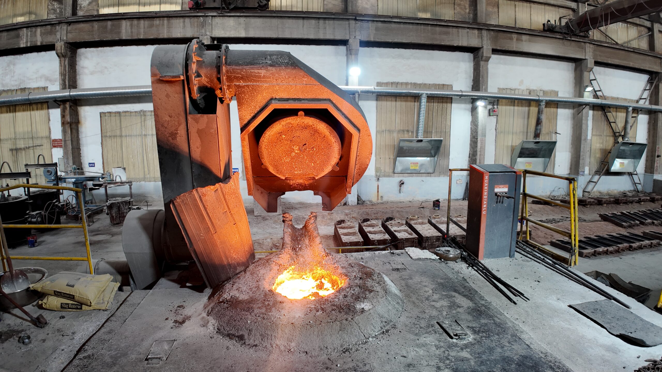 Medium frequency induction melting furnace pouring molten alloy steel at Shandong foundry